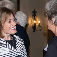 Donna Brooks speaking with a guest.